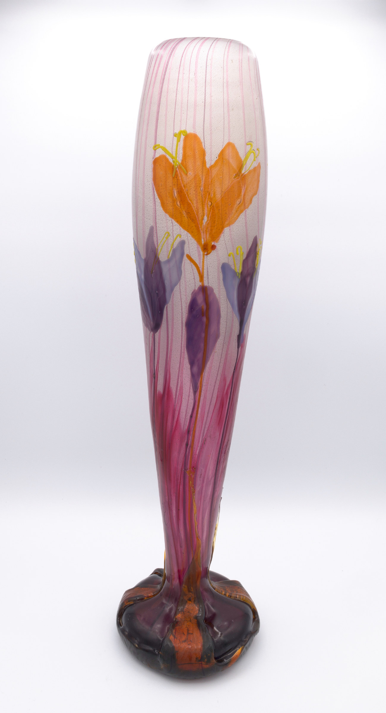 An Art Nouveau cameo glass vase in smoky amber and lavender, its surface carved in relief with the drooping bells and slender leaves of autumn crocus.