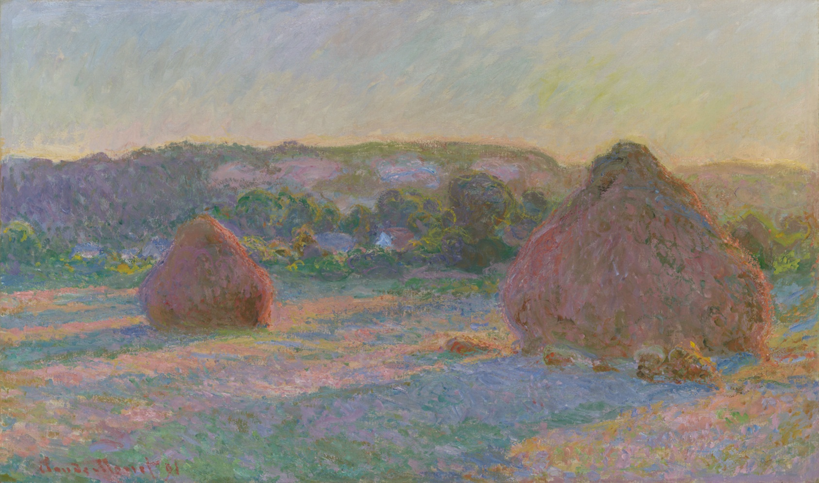 Two conical haystacks stand in a stubble field under a hazy sky, their long violet shadows stretching across the ground in the low light of late summer.