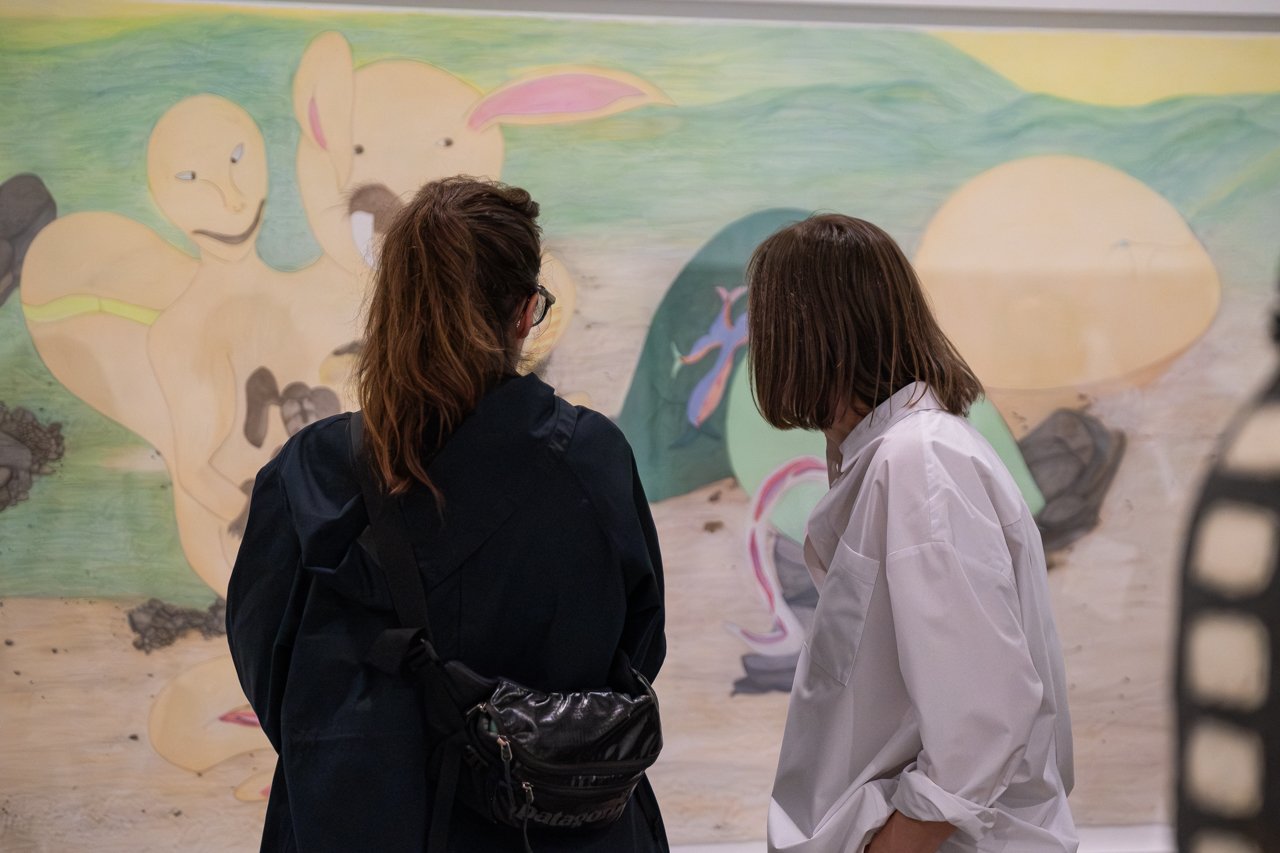 Two visitors view Shuvinai Ashoona’s large drawing Untitled, 2019