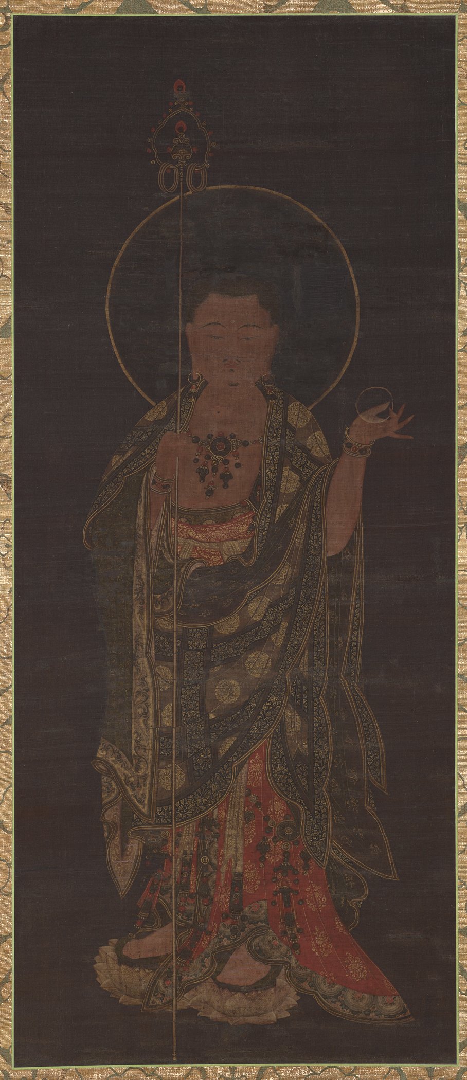 Tall Goryeo silk painting of the standing bodhisattva Ksitigarbha holding a jewel, in red and gold robes