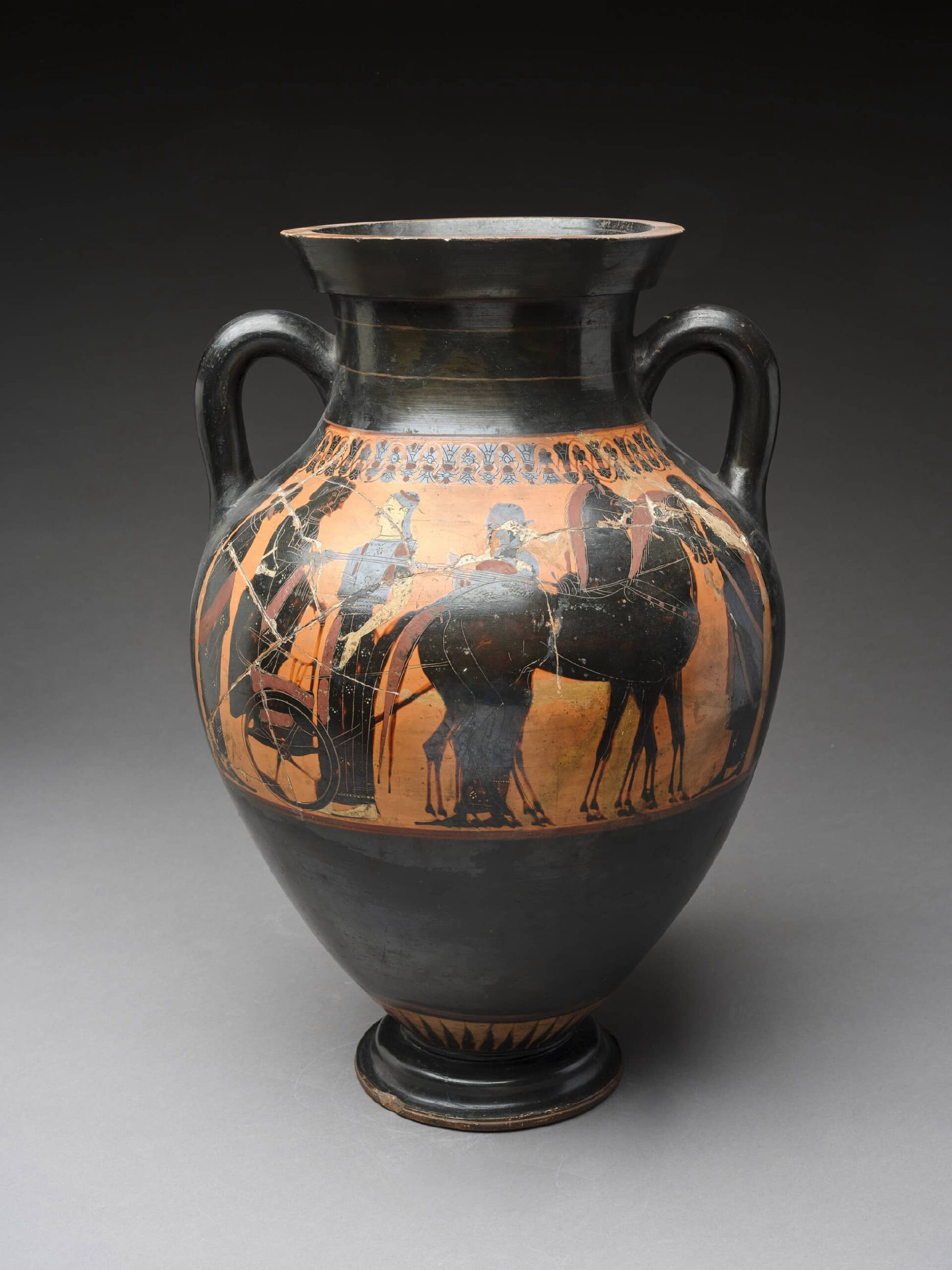 A terracotta amphora with several figures.