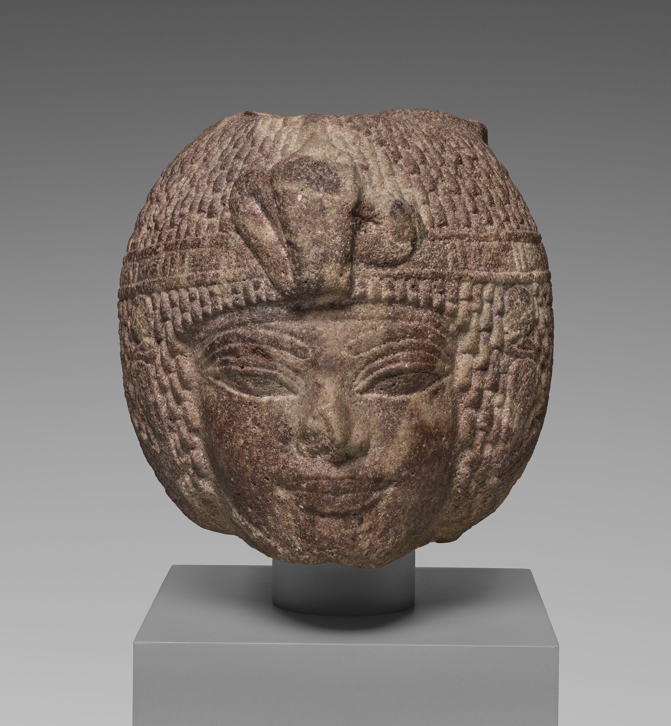 Brown quartzite head of Amenhotep III in a round wig, 1390–1352 B.C.