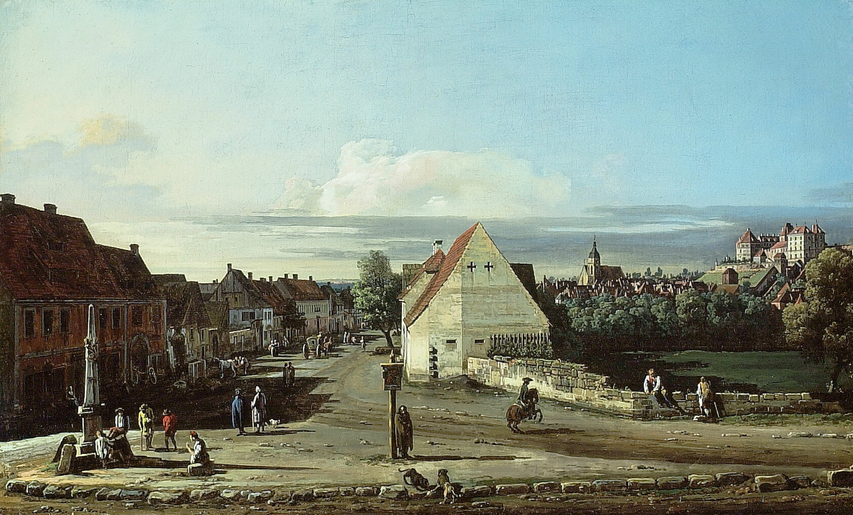 A sunlit town view: low ochre houses and small figures along a wide open street, with a hillside fortress and a distant town beyond, under a pale blue sky.
