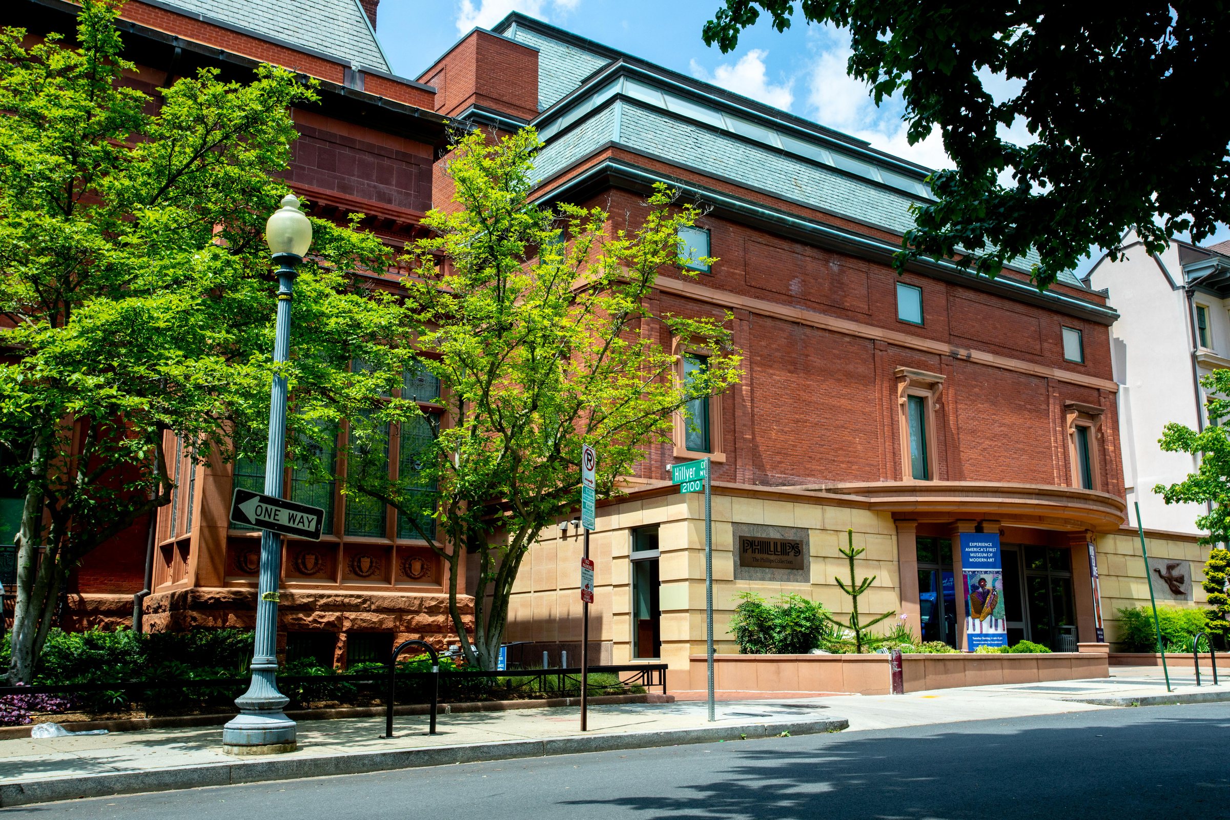 The Sant Building, the modern wing of The Phillips Collection, on the corner of 21st and Q Streets NW with an exhibition banner at the entrance