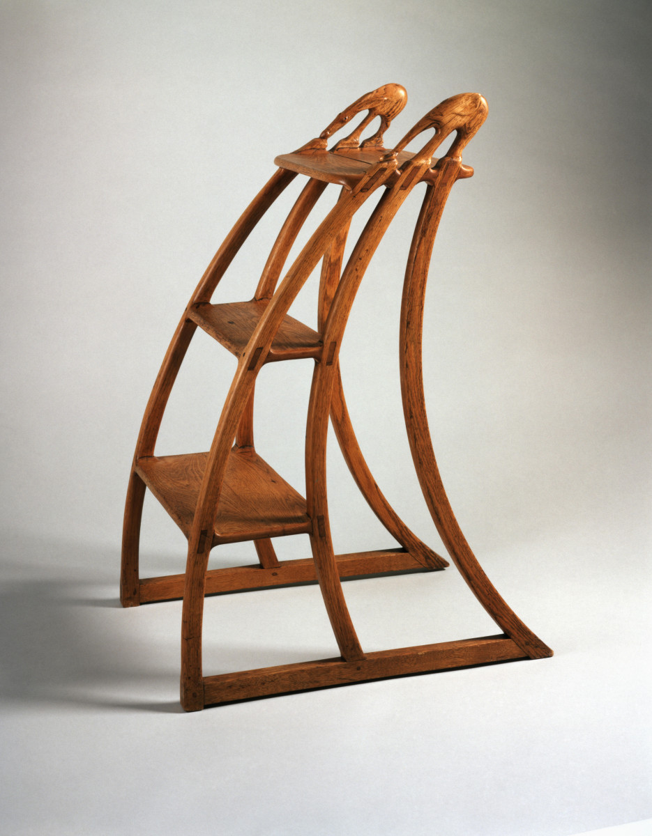 Wharton Esherick, Library Ladder Steps: a curving wooden step ladder whose uprights end in carved elephant and donkey finials