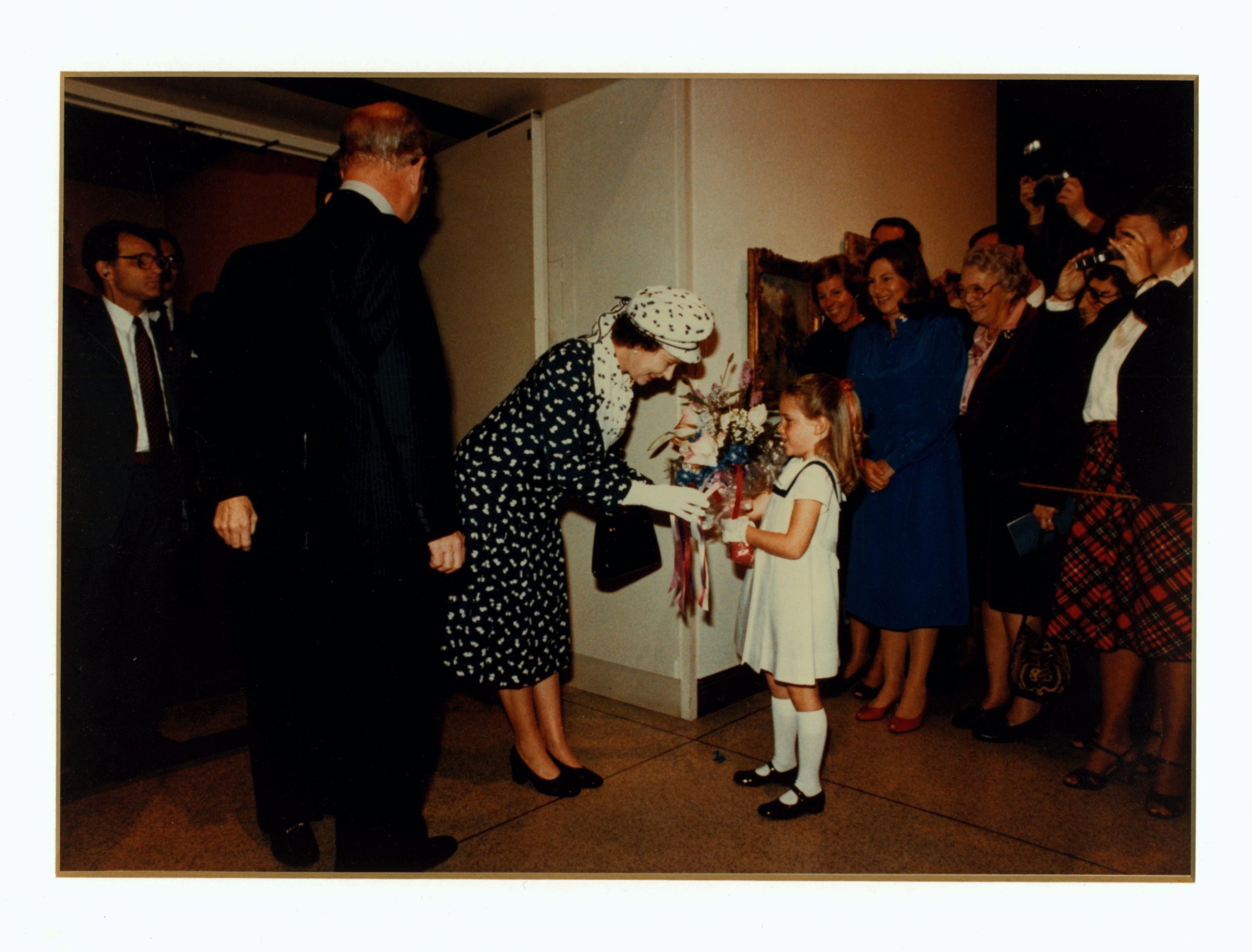 Queen Elizabeth II greeting a small child during her 1983 visit to the museum