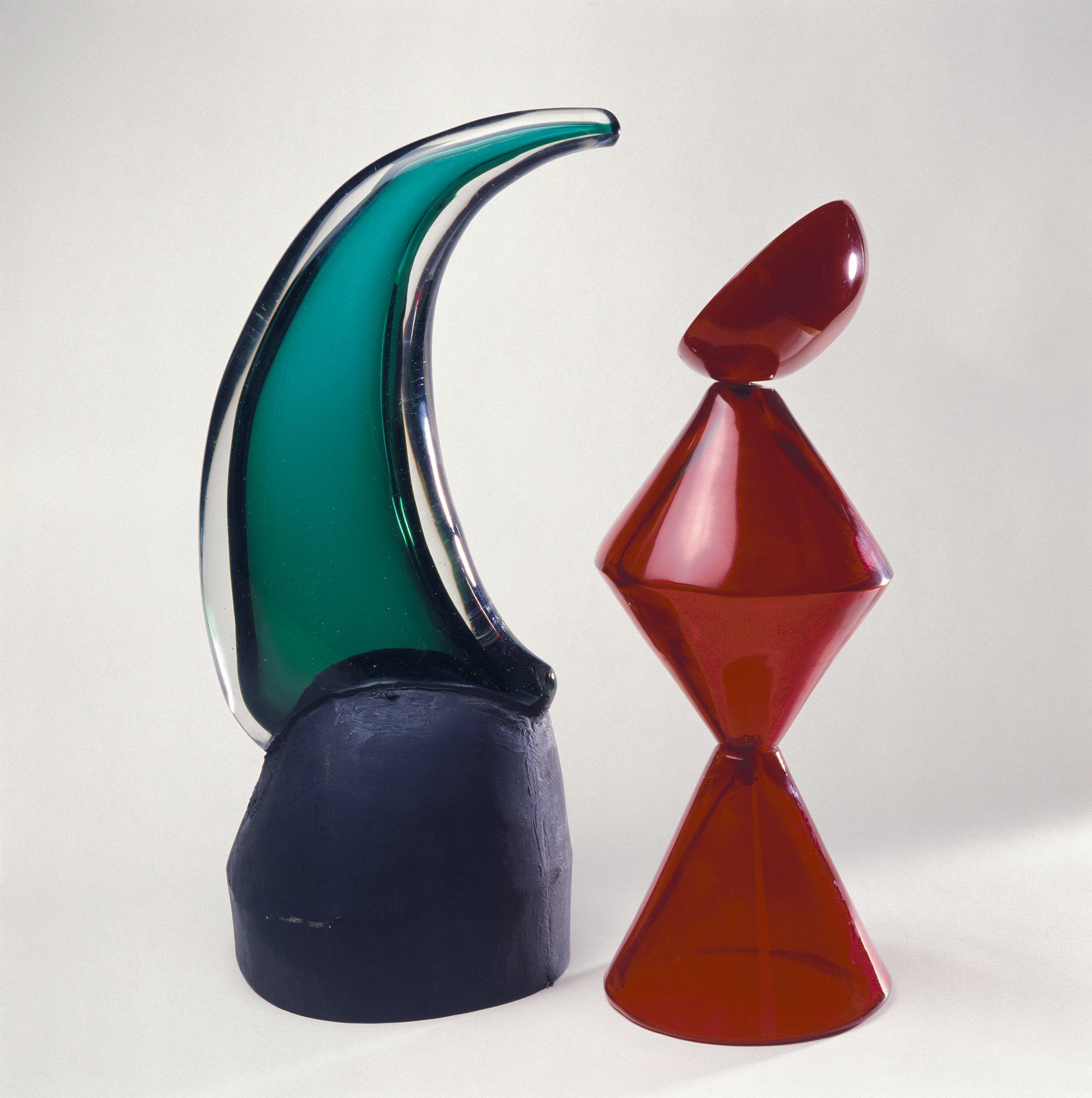 Max Ernst’s glass sculptures King and Queen, 1964, a green-and-black figure and a red blown-glass figure