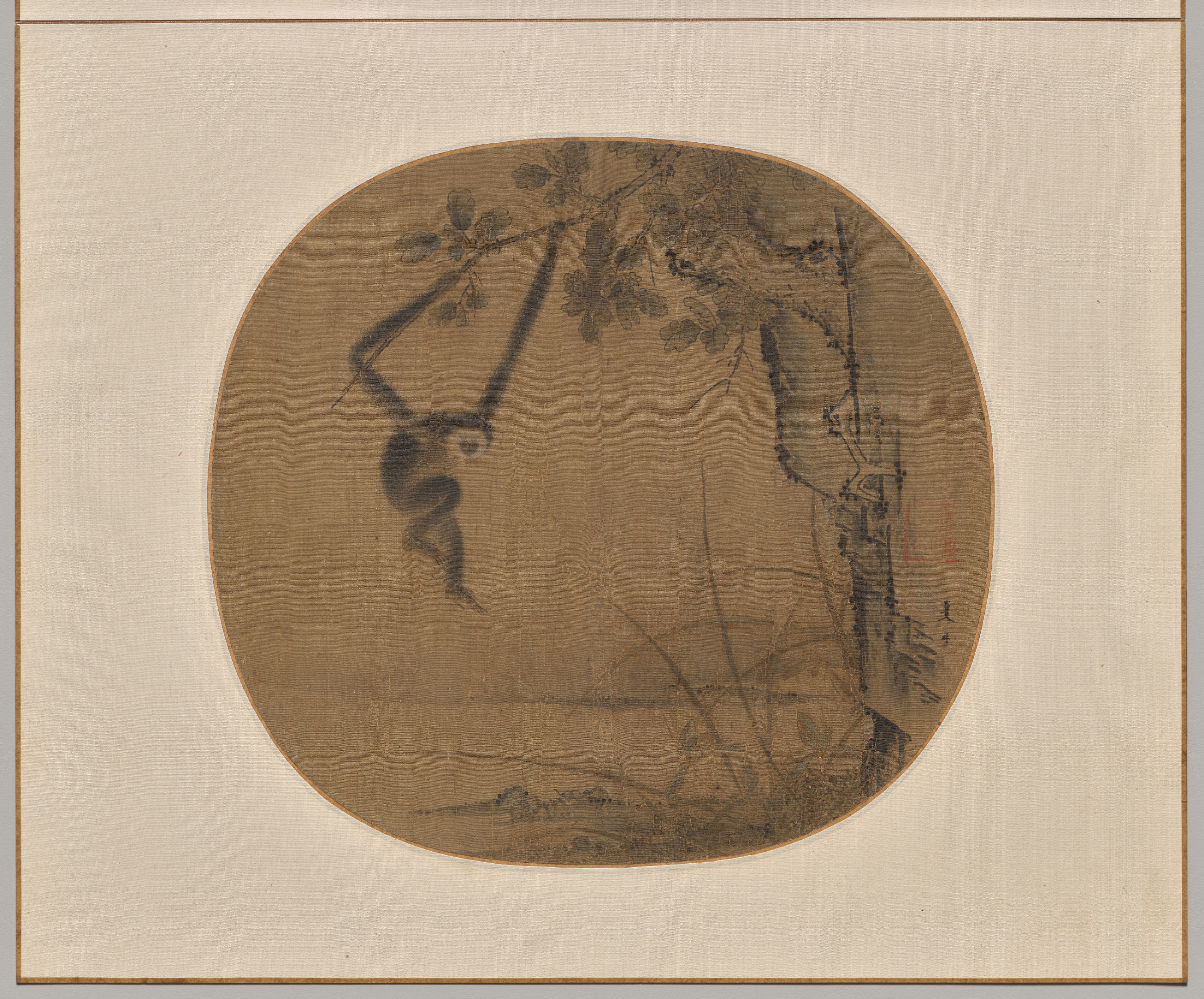An album leaf in ink and colour on silk showing a long-armed gibbon swinging from a slender branch, painted with rapid, economical brushstrokes.
