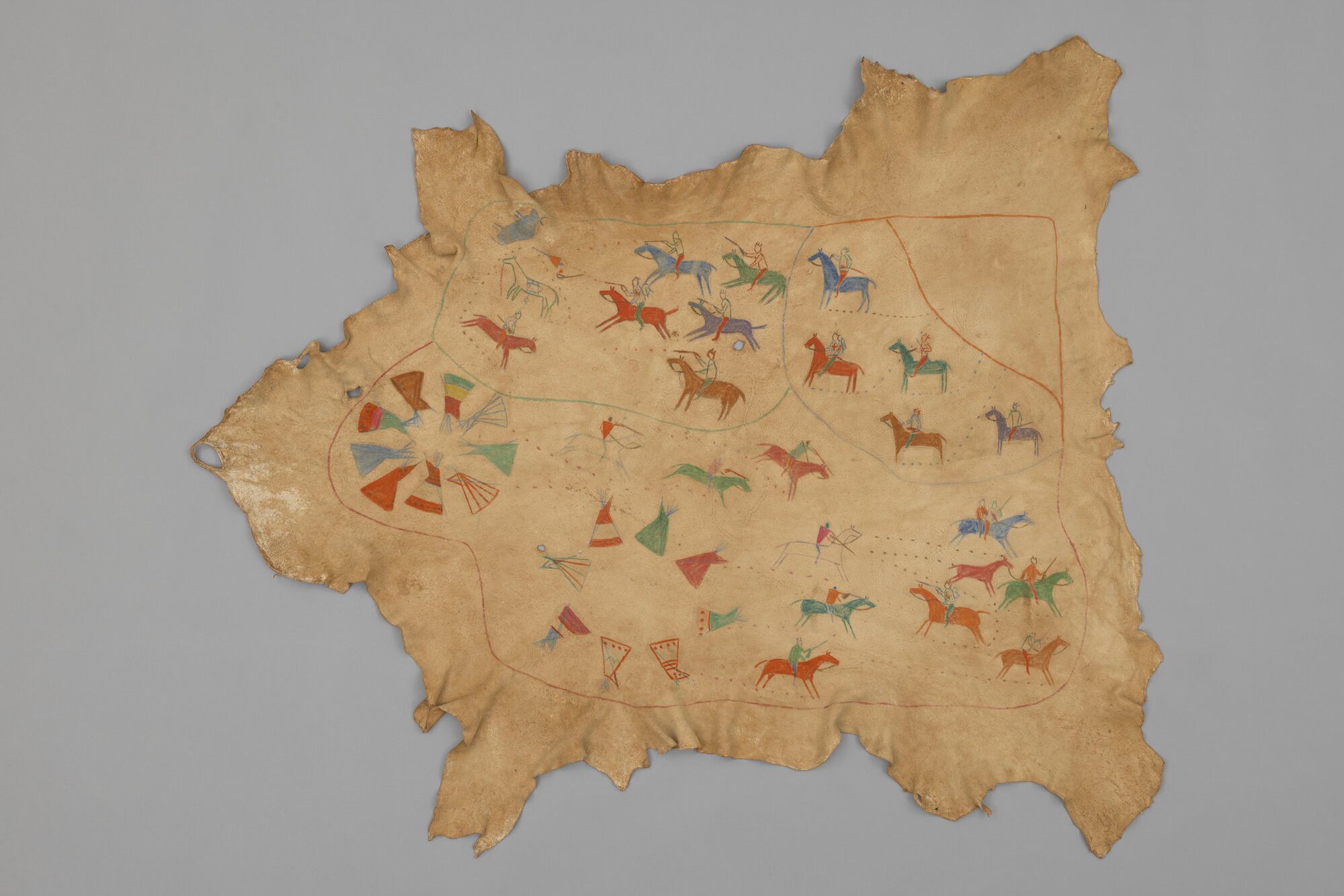 War Robe, possibly by Percy (Two Gun) Plain Woman, Káínai Nation (Blood Tribe), late 1880s to early 1900s, deer hide and pigment, on view in Storytellers at the Denver Art Museum