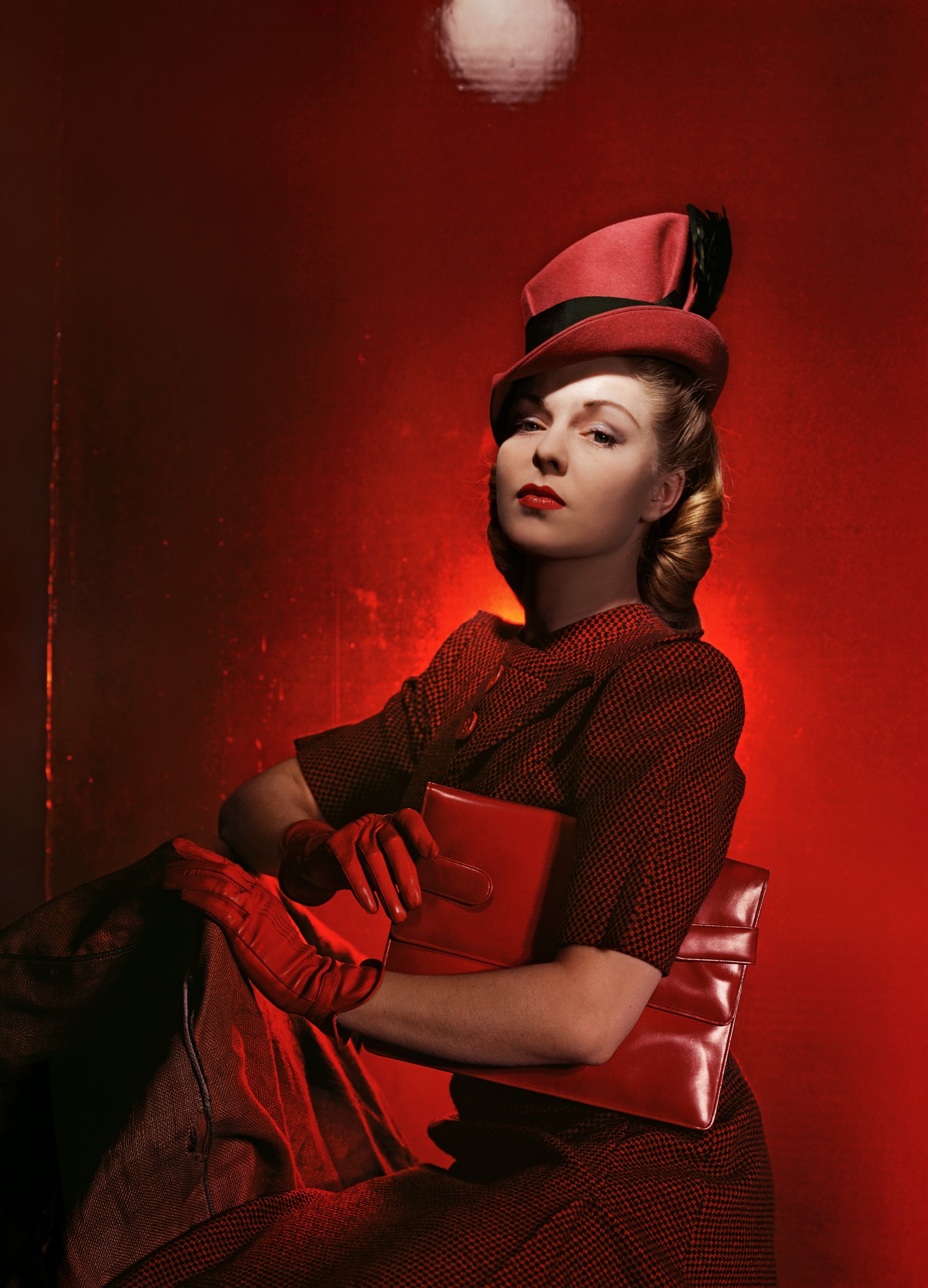 Cecil Beaton, The Second Age of Beauty Is Glamour: a woman in a red hat and red suit against a deep red background
