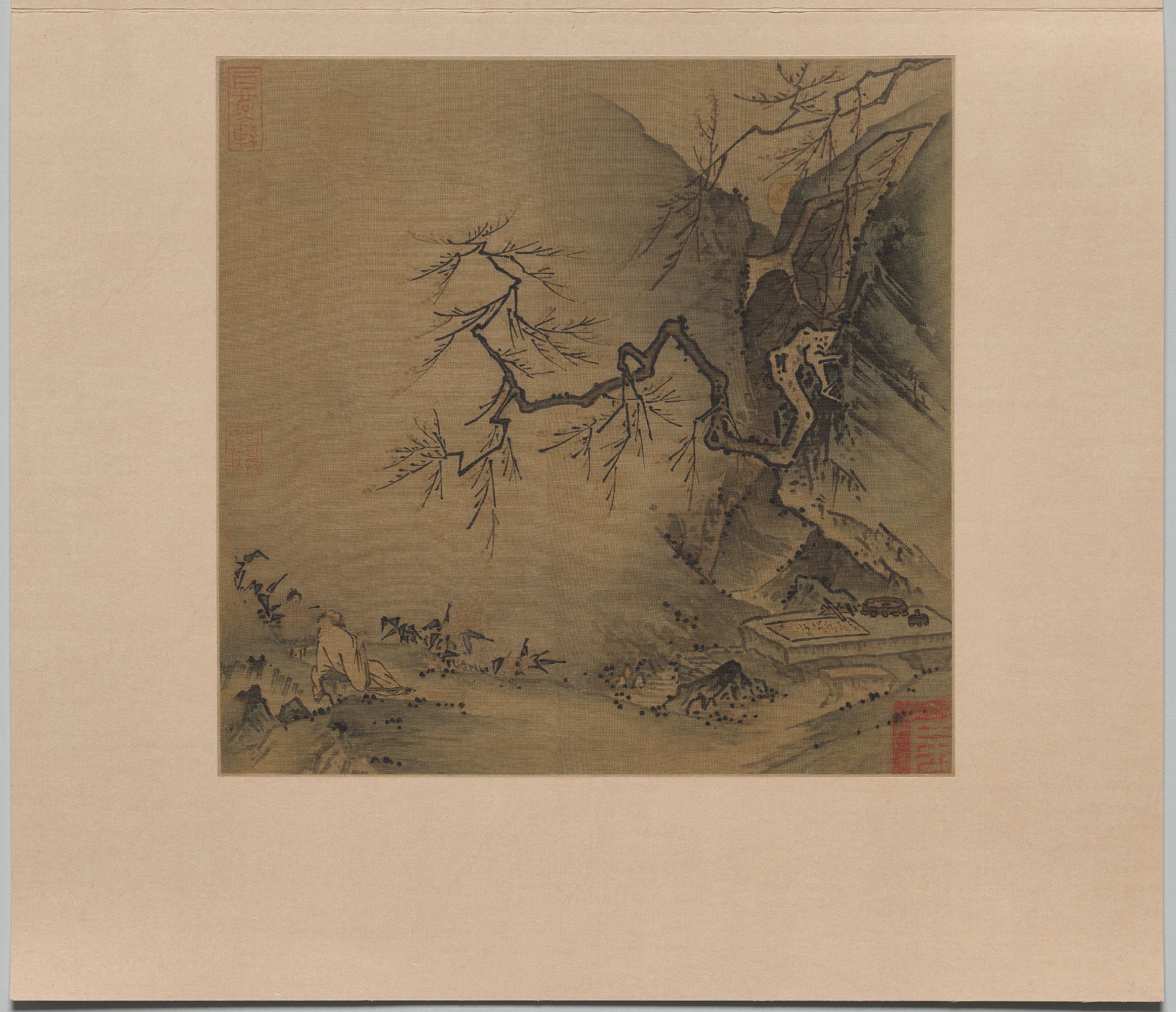 A square album leaf in ink on silk: a gnarled pine leans over a rocky ledge where tiny figures are gathered, the rest of the surface left as empty silk suggesting mist and moonlit air.