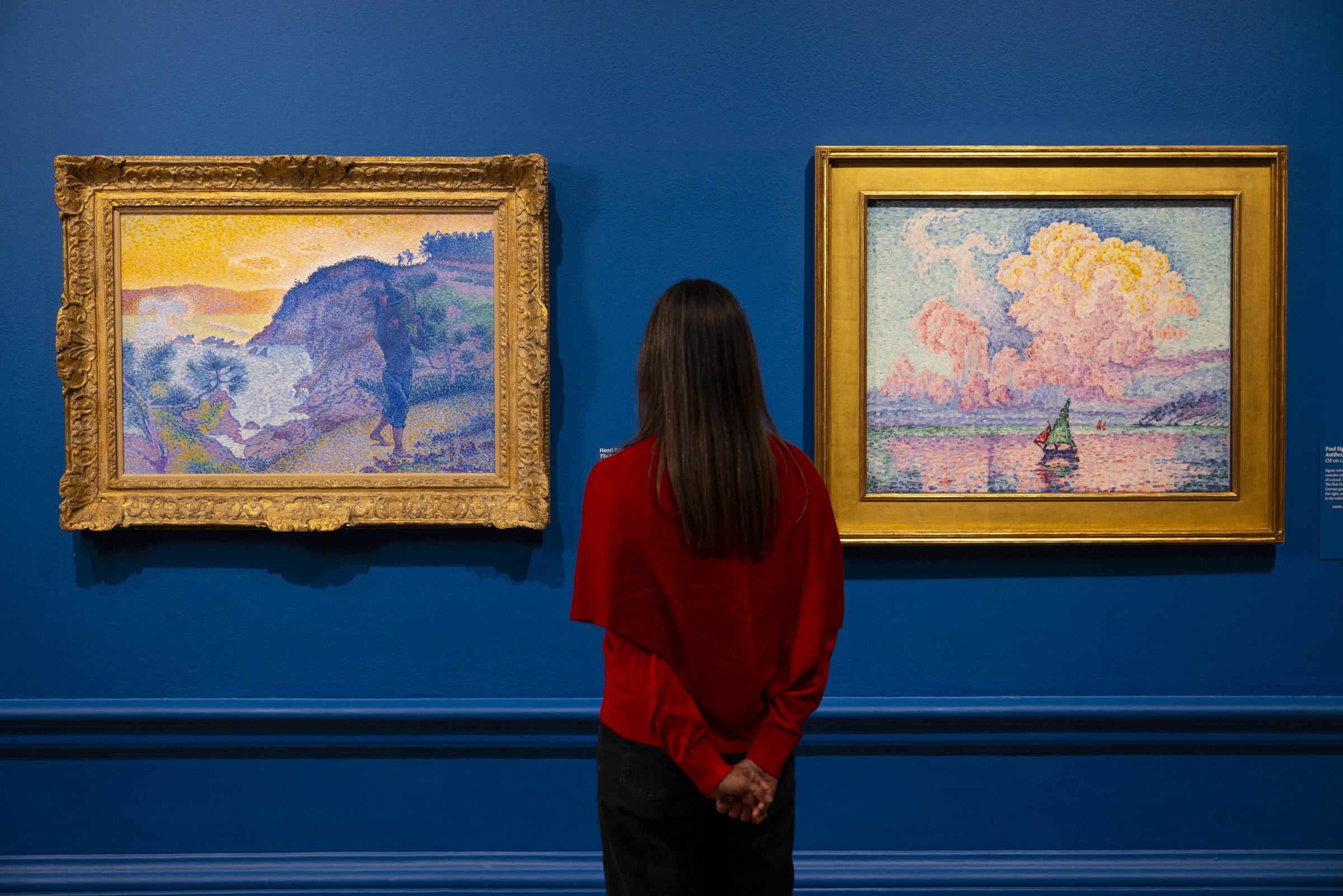 Painting the French Riviera at the Royal Academy of Arts, London: two landscape paintings with a visitor in red