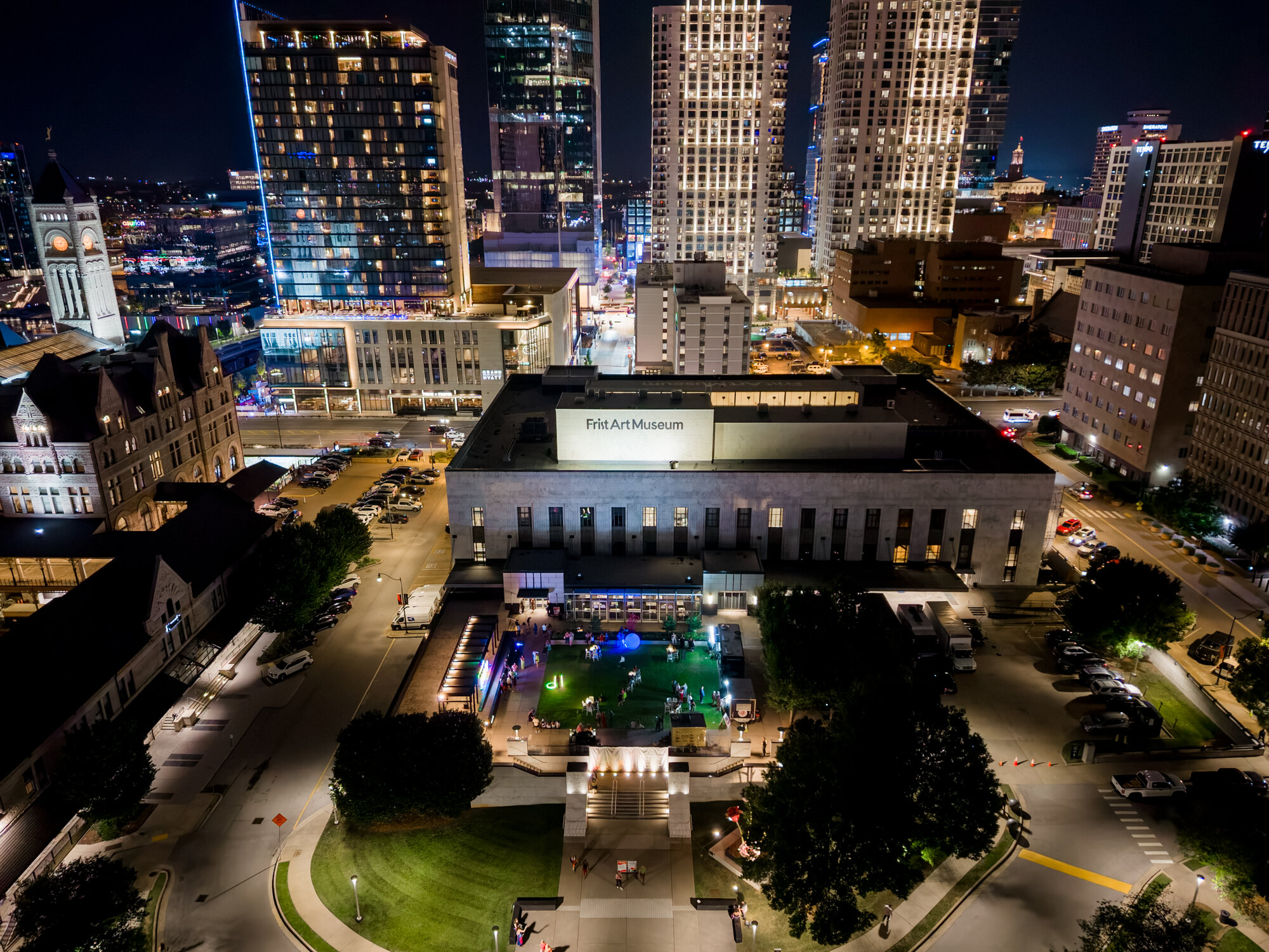 Aerial night view of the Frist Art Museum illuminated in downtown Nashville